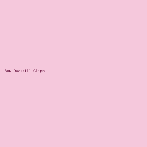 Set of pink and black bow-topped duckbill hair clips arranged on a white background.